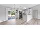 Bright, open kitchen and dining area with sliding doors that lead to the backyard at 2675 Cherokee St, North Port, FL 34286
