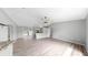 Large living room offers an open floor plan with wood-look floors, and eat-in kitchen at 2675 Cherokee St, North Port, FL 34286