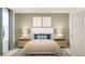 Bedroom with a comfortable bed, matching nightstands, and calming decor at 2691 Buttercup Lucine Ln, Ruskin, FL 33570