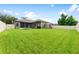 Expansive backyard featuring lush green grass, a privacy fence, and space for outdoor enjoyment and recreation at 2808 Abbey Grove Dr, Valrico, FL 33594