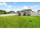 Well-maintained backyard featuring a shed, green lawn, and privacy fence at 2808 Abbey Grove Dr, Valrico, FL 33594