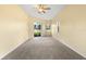 Spacious bedroom featuring neutral walls, a ceiling fan, and a sliding glass door to the outside at 2808 Abbey Grove Dr, Valrico, FL 33594