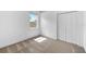 This bedroom offers a window, carpet, and a closet at 2808 Abbey Grove Dr, Valrico, FL 33594