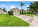 Charming home featuring a well-manicured lawn, mature landscaping, and a two-car garage at 2808 Abbey Grove Dr, Valrico, FL 33594