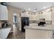 Spacious kitchen with stainless appliances, breakfast bar, and easy access to the dining area at 2808 Abbey Grove Dr, Valrico, FL 33594