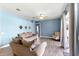 Comfortable living room with hardwood floors, neutral colored walls and access to the backyard at 2808 Abbey Grove Dr, Valrico, FL 33594