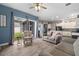 Open-concept kitchen and living room, featuring wood-look tile flooring and lots of natural light at 2808 Abbey Grove Dr, Valrico, FL 33594