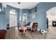 Inviting living room with hardwood floors, comfortable seating, and natural light, flowing into the open-concept kitchen at 2808 Abbey Grove Dr, Valrico, FL 33594