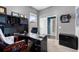 Home office with built-in shelving, gray walls and carpet at 2808 Abbey Grove Dr, Valrico, FL 33594