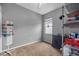 Well-lit storage room with shelving units for organized storage and window for natural light at 2808 Abbey Grove Dr, Valrico, FL 33594