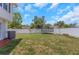 Expansive backyard featuring a white privacy fence and plenty of space for outdoor activities at 3035 Annadale, Brandon, FL 33511