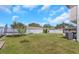 Spacious backyard with play area equipment, surrounded by a white fence for privacy at 3035 Annadale, Brandon, FL 33511