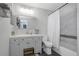 Well-lit bathroom with a sleek vanity, tub-shower combo with decorative tile surround, and modern fixtures for a clean aesthetic at 3035 Annadale, Brandon, FL 33511