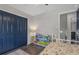 Bright bedroom with playful book display and ample closet space. Perfect for sleep and study at 3035 Annadale, Brandon, FL 33511