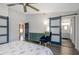 Bedroom showcasing a barn door leading to the en-suite bathroom, enhancing privacy and style with the room's modern design at 3035 Annadale, Brandon, FL 33511