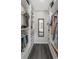 Bright, walk-in closet featuring custom shelving, hanging rods, and a full-length mirror for a luxurious dressing experience at 3035 Annadale, Brandon, FL 33511