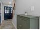 Entryway with a decorative cabinet, a dark front door, and stairway at 3035 Annadale, Brandon, FL 33511