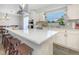 Bright kitchen features a large island with white countertops, stainless steel appliances, and a view from the sink at 3035 Annadale, Brandon, FL 33511