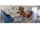 Sunlit living room features stylish seating, a bookshelf, and elegant decor, creating a welcoming atmosphere at 3035 Annadale, Brandon, FL 33511