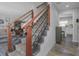 Stylish staircase featuring modern wood and iron railings, connecting to the inviting living space at 3035 Annadale, Brandon, FL 33511