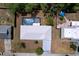 Birds eye view of home with pool, metal roof and lush landscaping at 30456 Willow Bank Ave, Brooksville, FL 34602