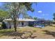 View of the backyard featuring a pool and screened in lanai at 30456 Willow Bank Ave, Brooksville, FL 34602