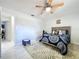 Bright bedroom featuring a ceiling fan, neutral walls, and modern decor at 30456 Willow Bank Ave, Brooksville, FL 34602