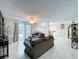 Spacious living room with backyard access, neutral décor and modern flooring at 30456 Willow Bank Ave, Brooksville, FL 34602
