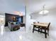 Open-concept living room adjacent to dining area, creating an inviting atmosphere for gatherings at 30456 Willow Bank Ave, Brooksville, FL 34602