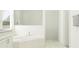 Bright bathroom with a soaking tub, modern tile, and sleek fixtures, creating a spa-like atmosphere at 31597 Cardinal Yard Dr, San Antonio, FL 33576