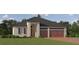 Charming single-Gathering home showcasing neutral stucco, complemented by a brick driveway and a two-car garage at 31597 Cardinal Yard Dr, San Antonio, FL 33576