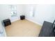 Comfortable bedroom with hardwood flooring and dual windows creating a bright atmosphere at 3515 E 8Th Ave, Tampa, FL 33605