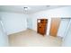 Spacious bedroom features light floors and an antique cabinet, providing ample storage at 3515 E 8Th Ave, Tampa, FL 33605