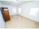 Bright bedroom features modern flooring and three windows for ample natural light at 3515 E 8Th Ave, Tampa, FL 33605