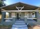 Attractive bungalow with a covered front porch, updated paint and easy front yard access at 3515 E 8Th Ave, Tampa, FL 33605