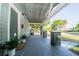 Comfortable front porch with updated features, including fresh plants and a new welcome mat at 3515 E 8Th Ave, Tampa, FL 33605
