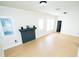 Open living room with beautiful hardwood floors, fresh paint, and a decorative fireplace at 3515 E 8Th Ave, Tampa, FL 33605
