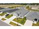 A high aerial of the home with a view of the pond in the distance at 35519 Bellington Blvd, Zephyrhills, FL 33541