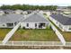 Aerial shot of the home's backyard, featuring a well-maintained lawn and patio at 35519 Bellington Blvd, Zephyrhills, FL 33541