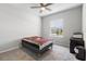 This bedroom features a neutral decor, large window and carpet at 35519 Bellington Blvd, Zephyrhills, FL 33541