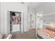 Bedroom featuring a view to ensuite bath, large closet and play bed at 35519 Bellington Blvd, Zephyrhills, FL 33541