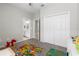 Spacious bedroom featuring carpet flooring, a closet, and a view into the bathroom at 35519 Bellington Blvd, Zephyrhills, FL 33541