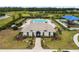 Community clubhouse featuring a pool, playground, and well-maintained landscaping at 35519 Bellington Blvd, Zephyrhills, FL 33541