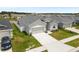 Attractive single-Gathering house showcasing a neatly kept lawn and a convenient two-car garage at 35519 Bellington Blvd, Zephyrhills, FL 33541
