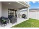 Outdoor patio featuring seating, a barbecue grill, and a view of the backyard at 35519 Bellington Blvd, Zephyrhills, FL 33541