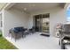 Relaxing patio featuring an outdoor seating area with backyard views and a grill at 35519 Bellington Blvd, Zephyrhills, FL 33541