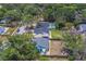 Aerial perspective of homes in a serene, tree-filled neighborhood, highlighting residential tranquility at 3852 Berkshire Ct, Palm Harbor, FL 34684