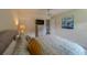 This spacious bedroom includes tile floors, a ceiling fan, and neutral paint at 3852 Berkshire Ct, Palm Harbor, FL 34684