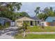 Charming yellow single-story home with well-maintained lawn and inviting curb appeal at 3852 Berkshire Ct, Palm Harbor, FL 34684