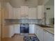 Updated kitchen featuring stainless steel appliances, ample cabinetry, and a modern design at 3852 Berkshire Ct, Palm Harbor, FL 34684